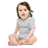 Child wearing a gray onesie with 'ex-superhero' text on a white background