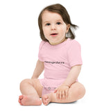 Child wearing a pink 'ex-superhero' onesie on a white background
