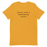 T-Shirt – Person with a devastating secret (black text)