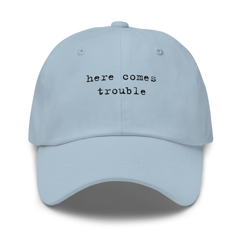 Storymatic hat – Here Comes Trouble (black text)